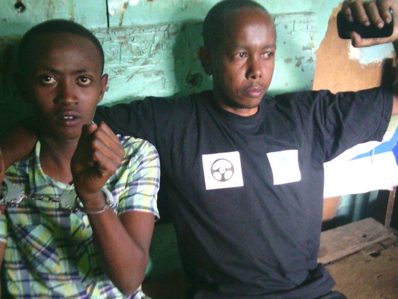Handcuffed Mwangi Manjoya and Joseph Ndiritu under police arrest in Nairobi