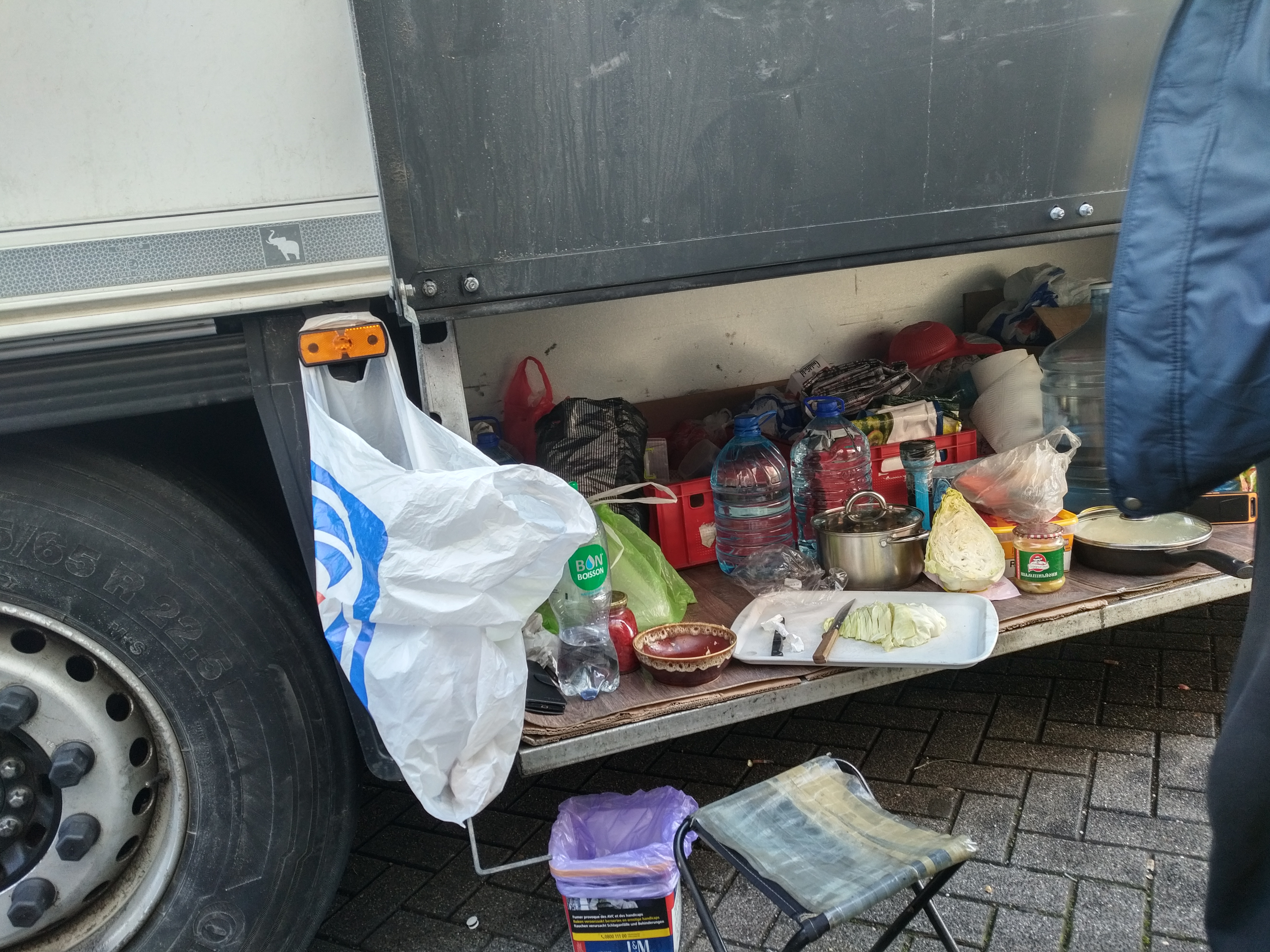 Truck drivers use whatever space they can to prepare food