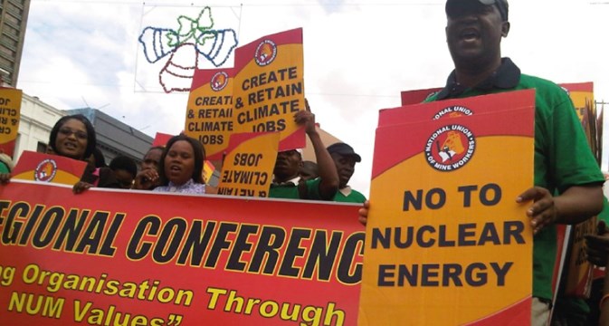 Climate justice education - people holding banners