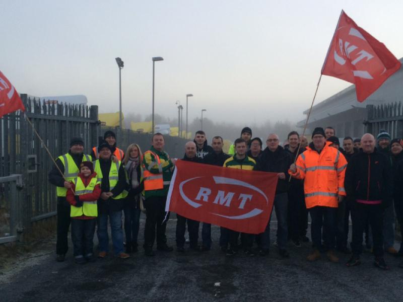 Mick Ward (left of banner) and other protesters at Motherwell City Link depot