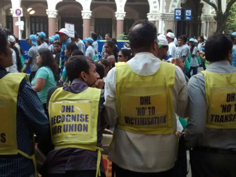 DHL workers and activists protest at Mumbai Marathon