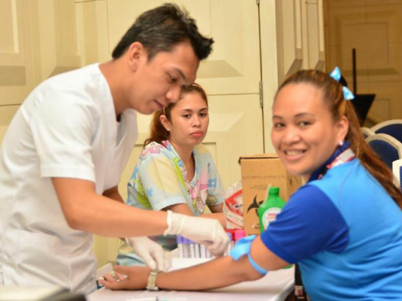 Cruise ship seminar participants having voluntary HIV tests 