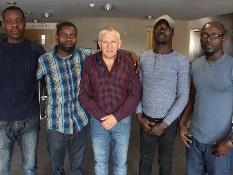 KEN FLEMING WITH JOSHUA, JAMES, NOEL AND JOHN WHO WERE SAVED FROM AN IRISH FISHING VESSEL