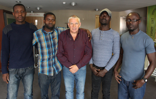 KEN FLEMING WITH JOSHUA, JAMES, NOEL AND JOHN WHO WERE SAVED FROM AN IRISH FISHING VESSEL
